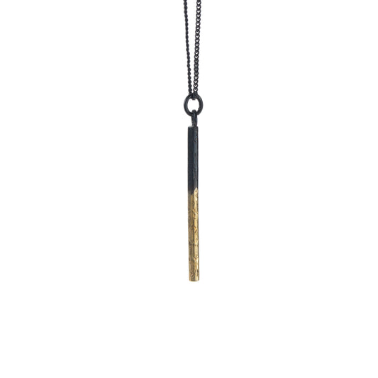 Oxidised silver pillar pendant with gold detail on an 18-inch chain by Bianca O’Neill Jewellery.