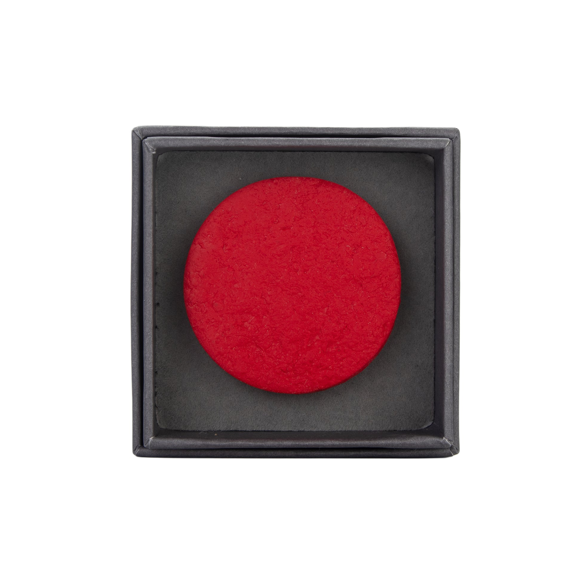Handmade red polymer clay circular brooch by Olivia Jacq Jewellery.