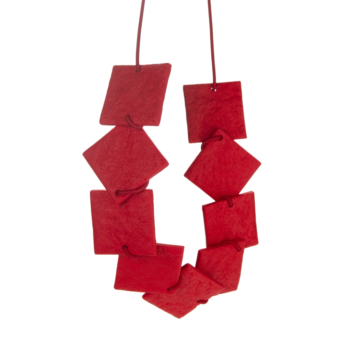 Red polymer clay statement necklace with cascading square elements by Olivia Jacq Jewellery.