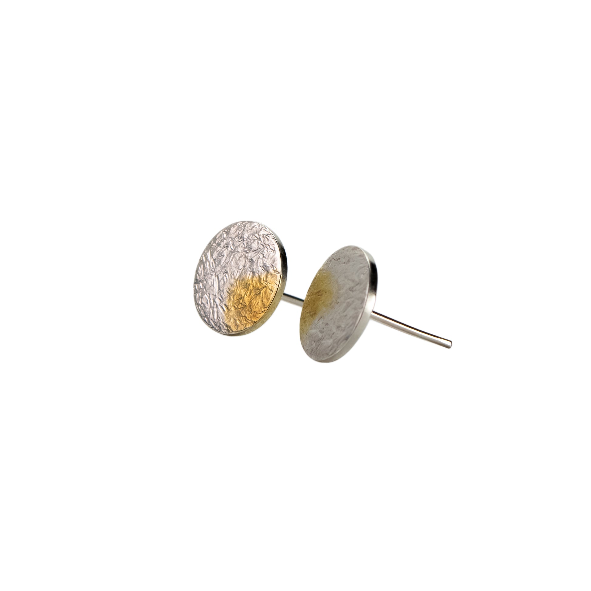 Pair of round earrings with textured surfaces on a white background