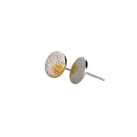 Pair of round earrings with textured surfaces on a white background